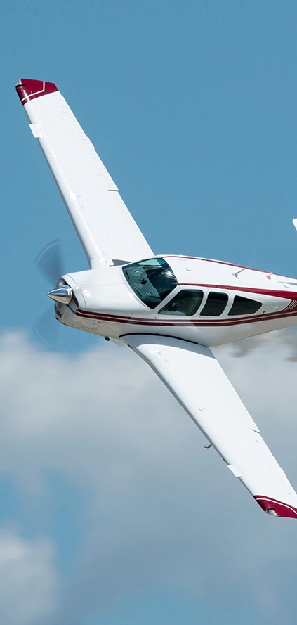 close up of a plane flying from a side angle.